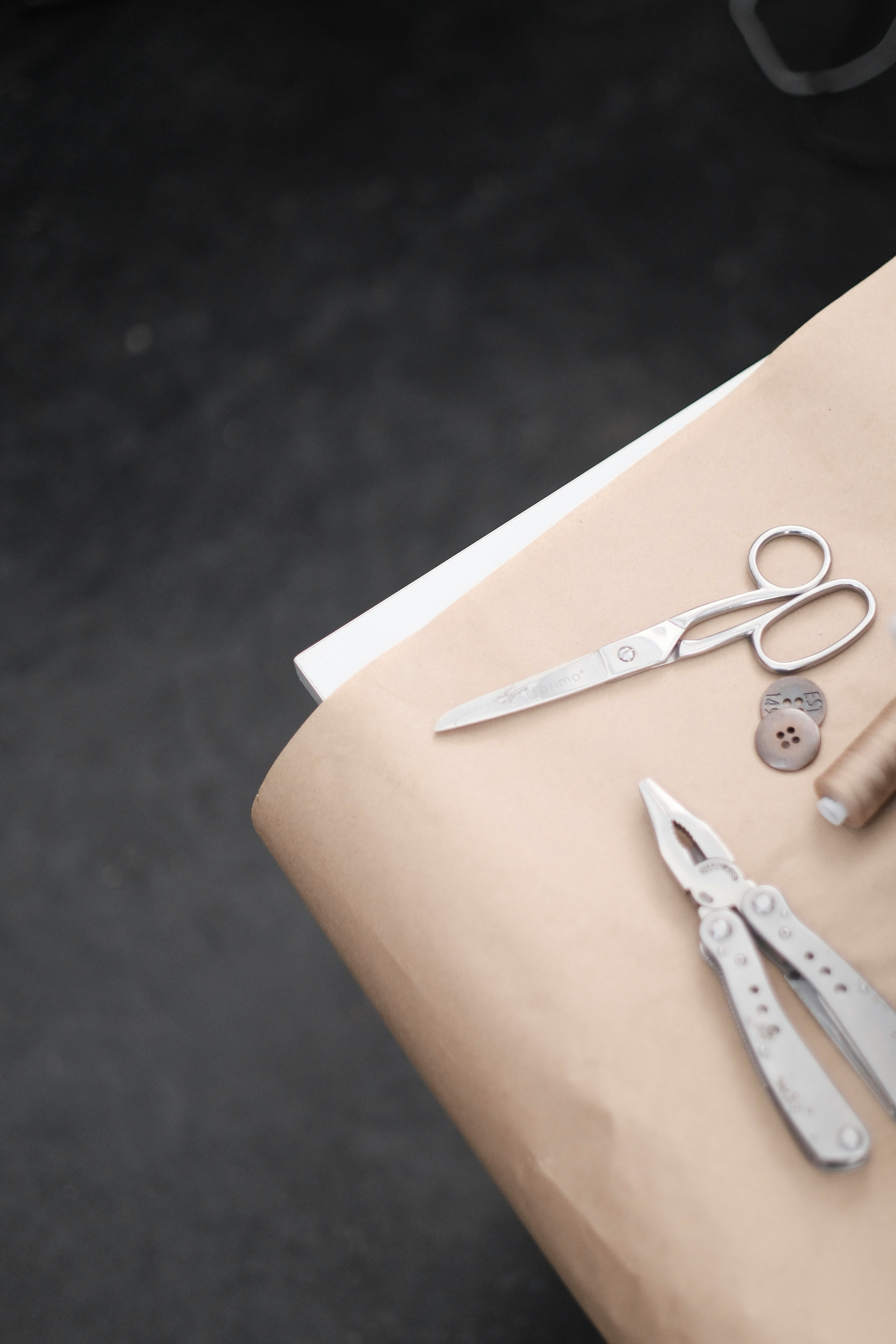 silver scissors on brown paper